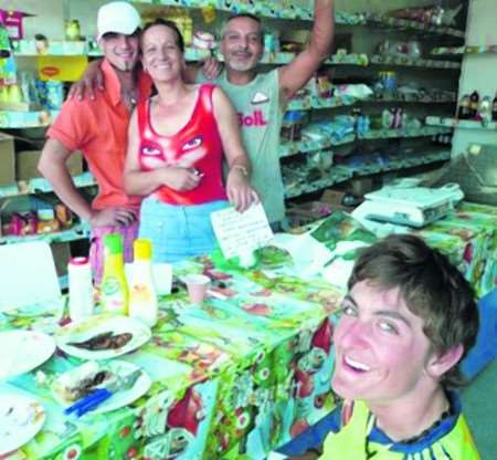 Sam Swain with shop owners Maria, Marion and Daniel in Rosion, Romania
