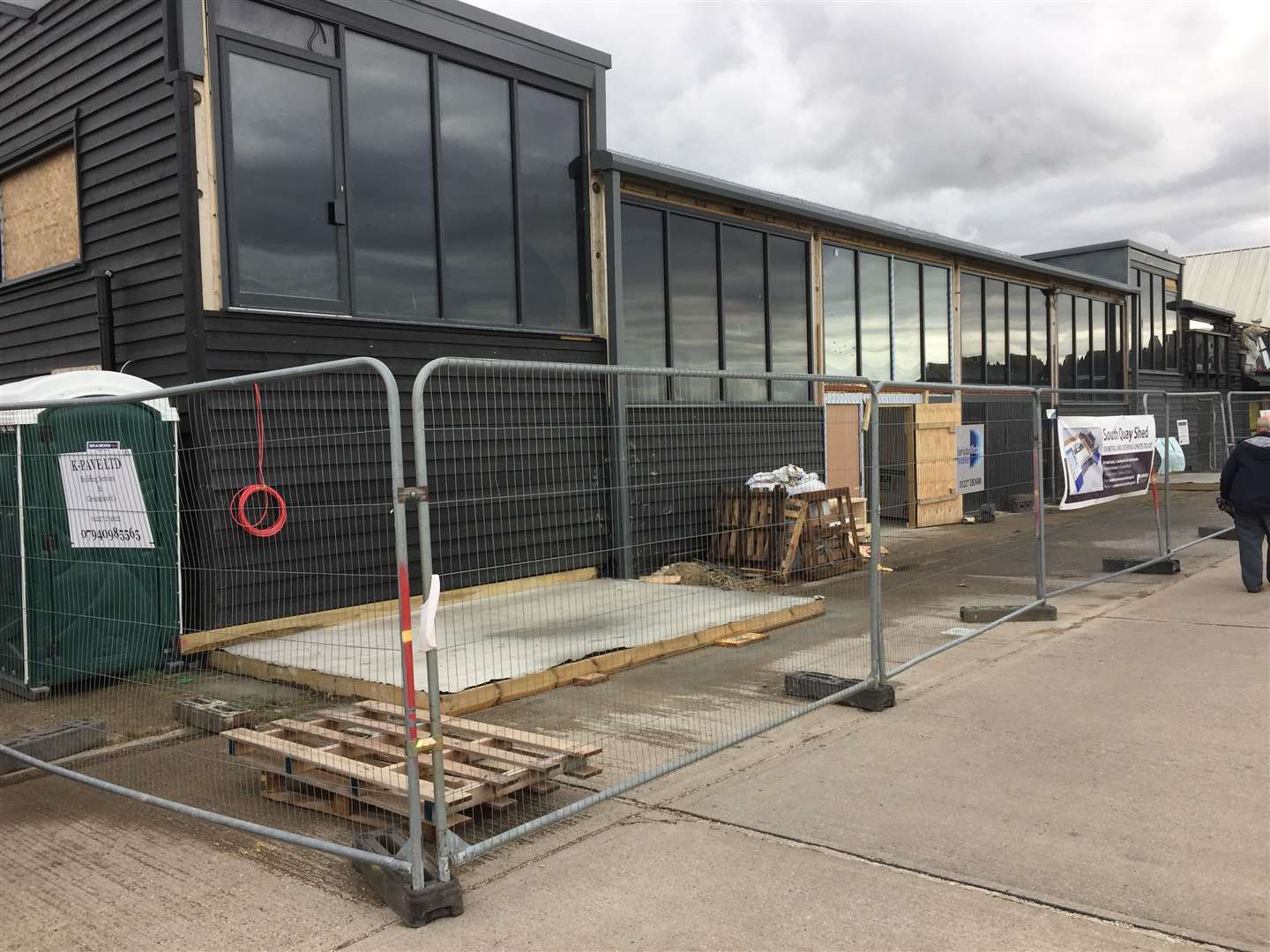 The South Quay Shed with the two plots for kiosks outside in Whitstable harbour