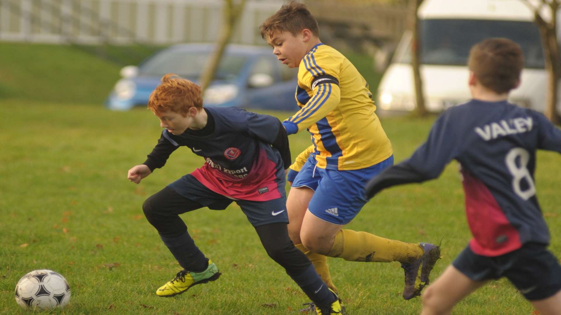 Strood 87, in yellow, give chase against Hempstead Valley in Under-12 Division 1 Picture: Steve Crispe