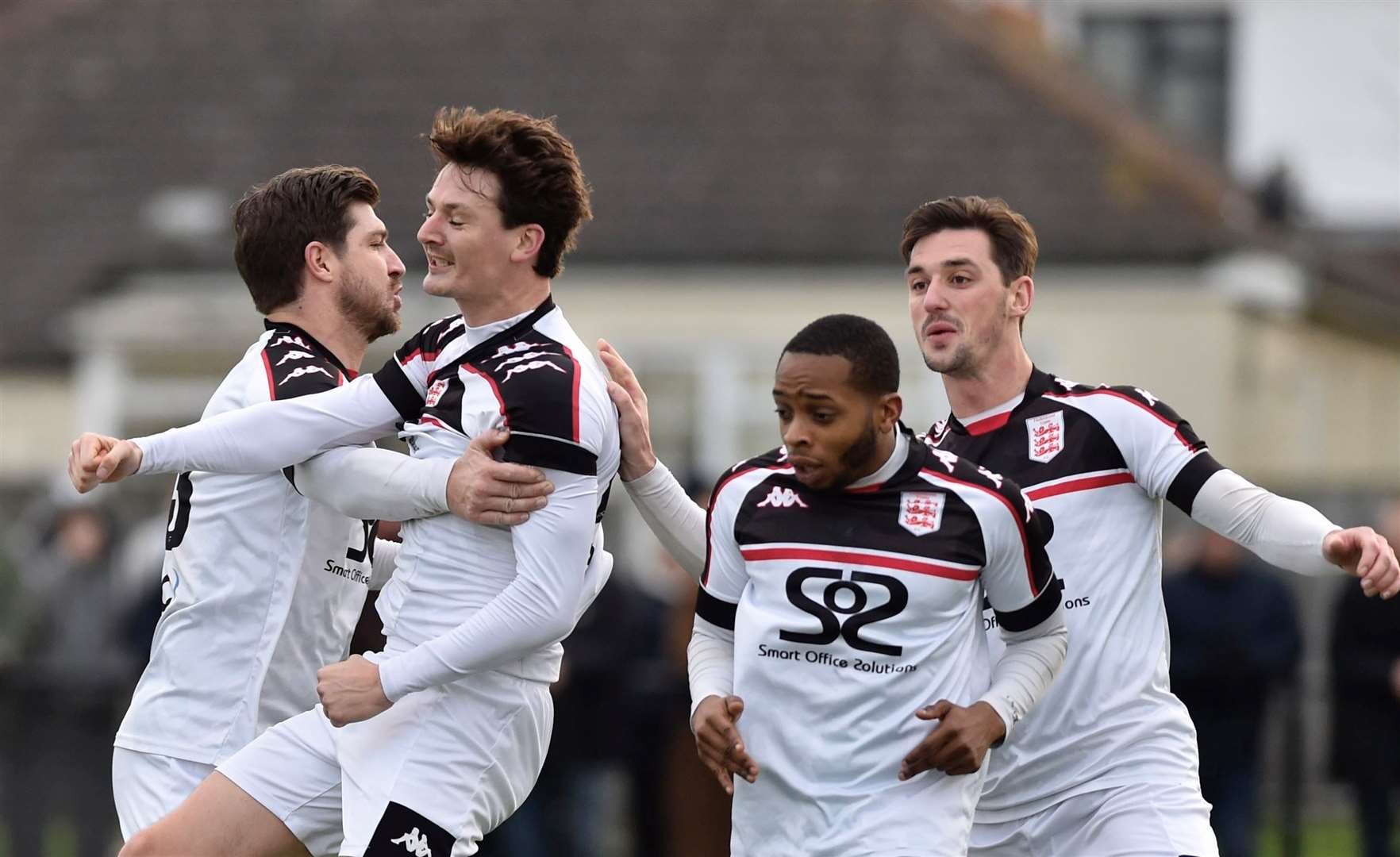 Billy Bennett celebrates giving Faversham the lead with team-mates Matt Newman, Sam Hasler and Kieron Campbell during their 2-2 draw at Whitstable on Saturday. Picture: Ian Scammell