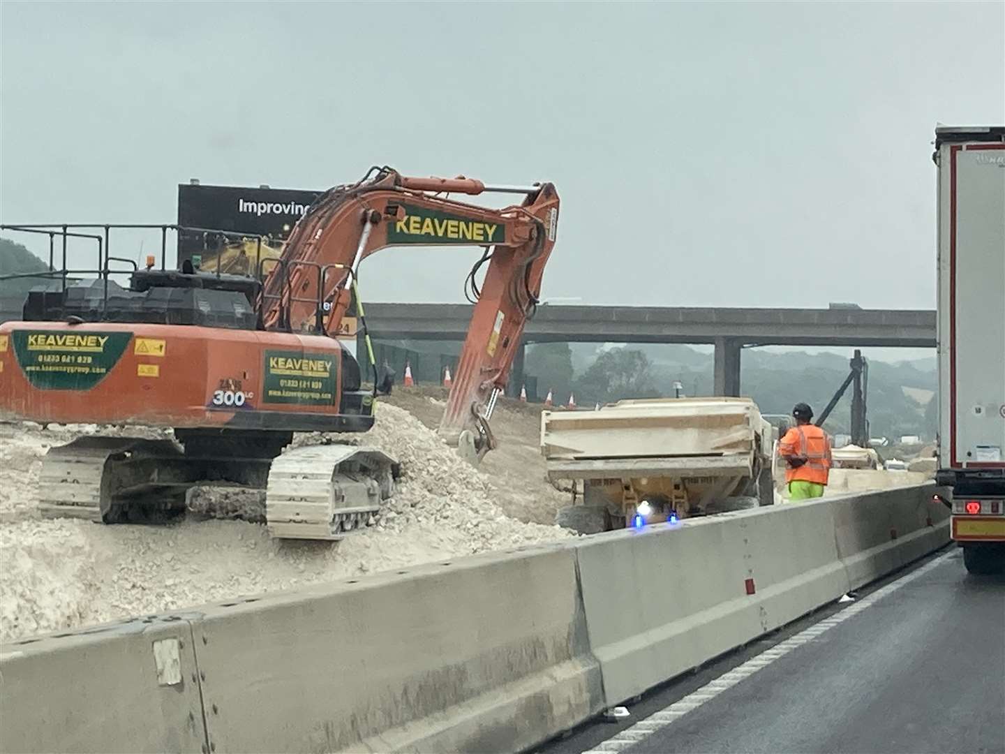 Digger beside the A249 Maidstone-bound carriageway approaching Stockbury roundabout