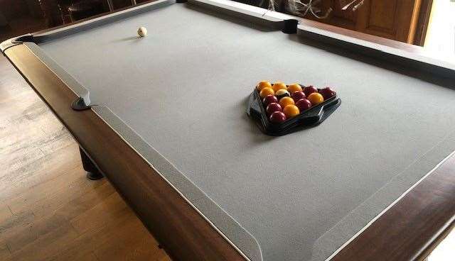 The barmaid wasn’t sure who left the pool balls racked for a frame