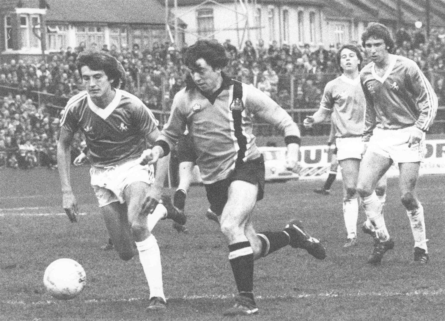 Maidstone United's Frank Ovard breaks clear of Gills defender John Overton in the first meeting at Priestfield Picture: Roger Vaughan