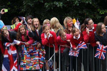 Children gather in Gillingham to welcome the Olympic torch. Picture: Rebecca Hughes