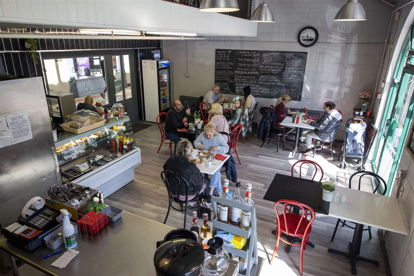 Customers returning to indoor hospitality at D&G’s Bistro Cafe at Smithfield Market in Belfast (Liam McBurney/PA)