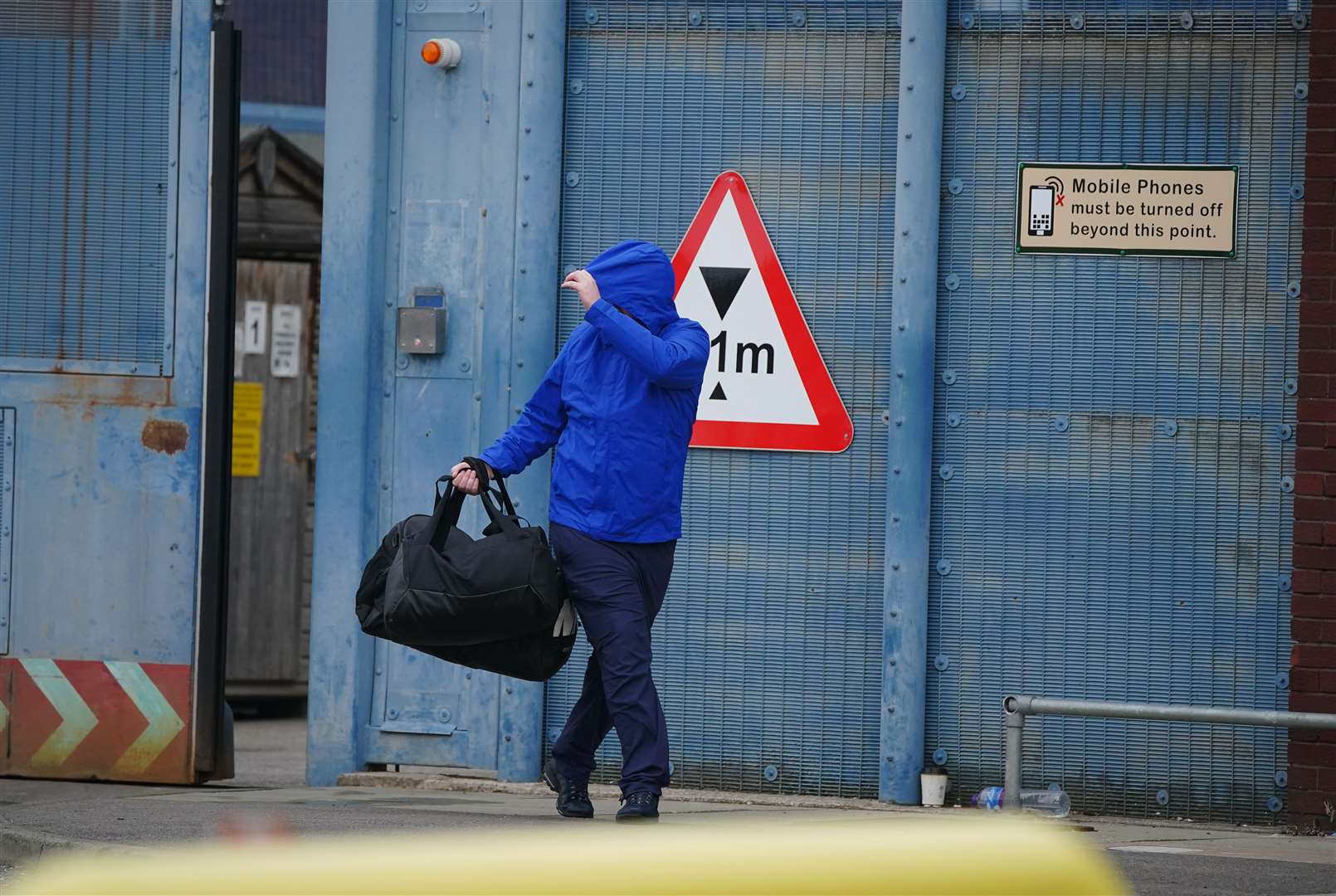 People were seen leaving HM Prison Liverpool as around inmates were expected to be let out early (Peter Byrne/PA)