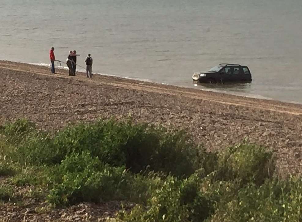 An atempt was made to pull the 4x4 from the waves. Picture: Eden Hammond