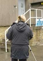 A police scenes-of-crime officer photographing one of the entrances to the depot. Picture: ANDY PAYTON