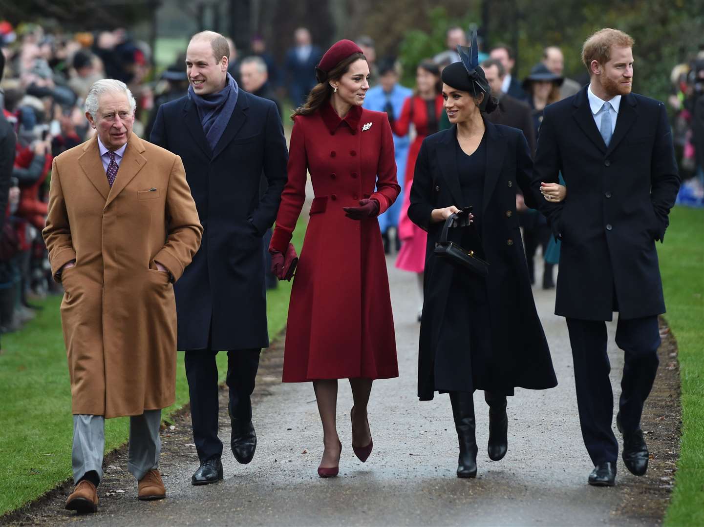 The couple with Charles, William and Kate at the Christmas Day morning church service in 2018 (Joe Giddens/PA)