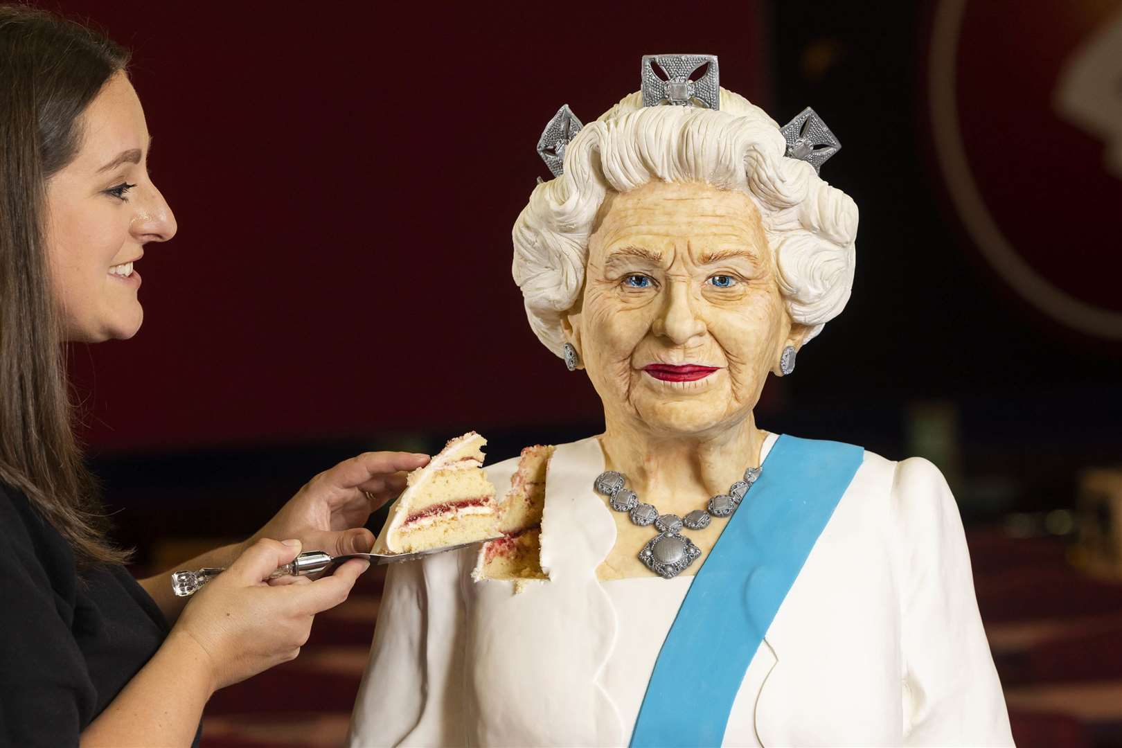 Baker Lara Mason of Cake Anything unveils a life-sized cake of Queen Elizabeth II, (Fabio De Paola/PA)