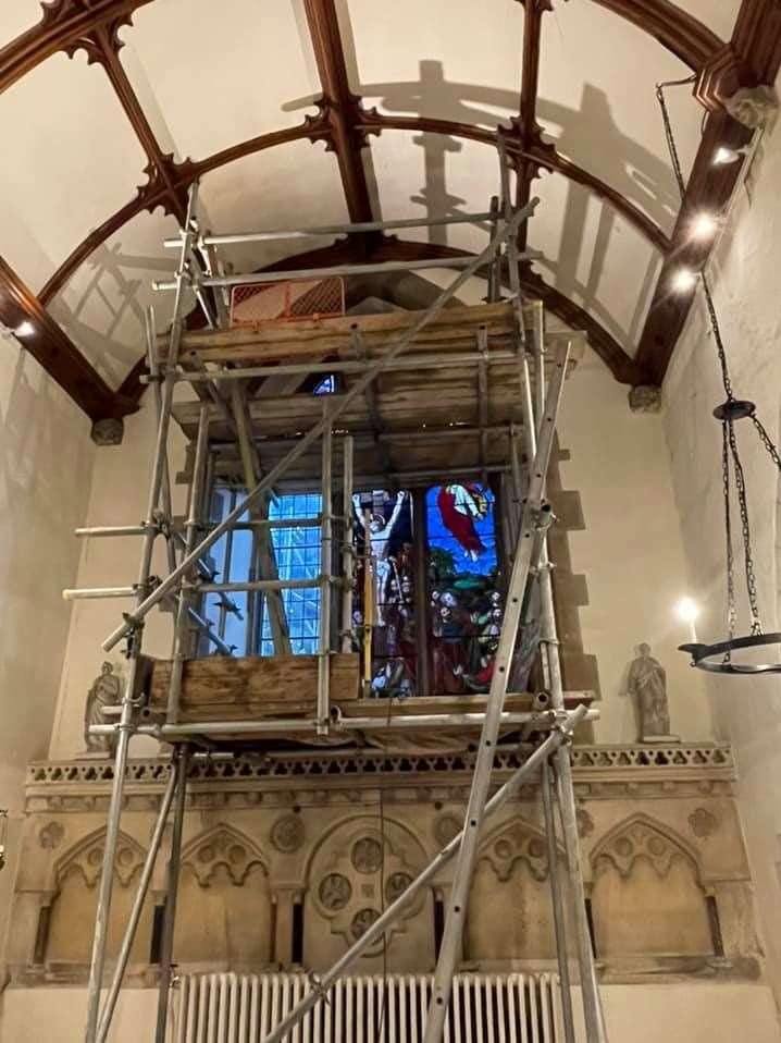 Two-thirds finished - reinstalling the stained-glass window at Borden parish church