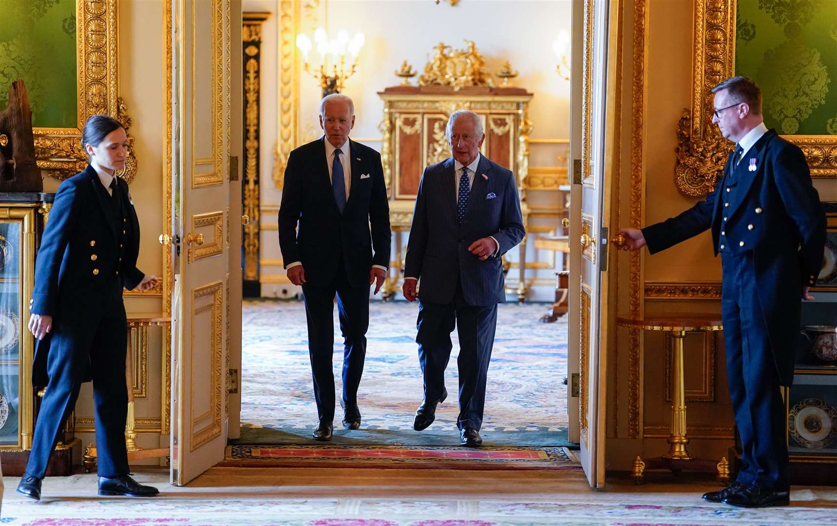 King Charles III and US President Joe Biden arrive to meet participants of the Climate Finance Mobilisation forum in the Green Drawing Room at Windsor Castle. Andrew Matthews/PA