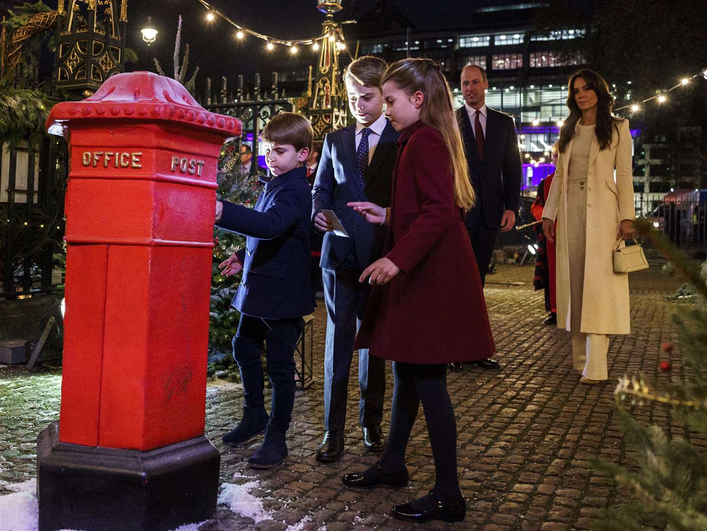 Before the 2023 service, William and Kate watched as Louis, George and Charlotte posted Christmas cards to children who may have been struggling last festive season (Jordan Pettitt/PA)