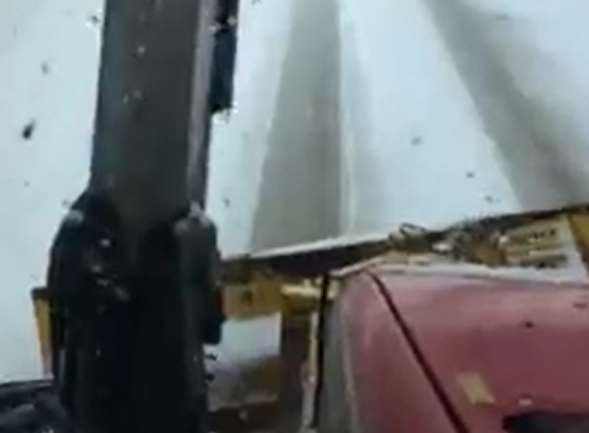 Farmers using snow ploughs clearing roads in the Lower Halstow area