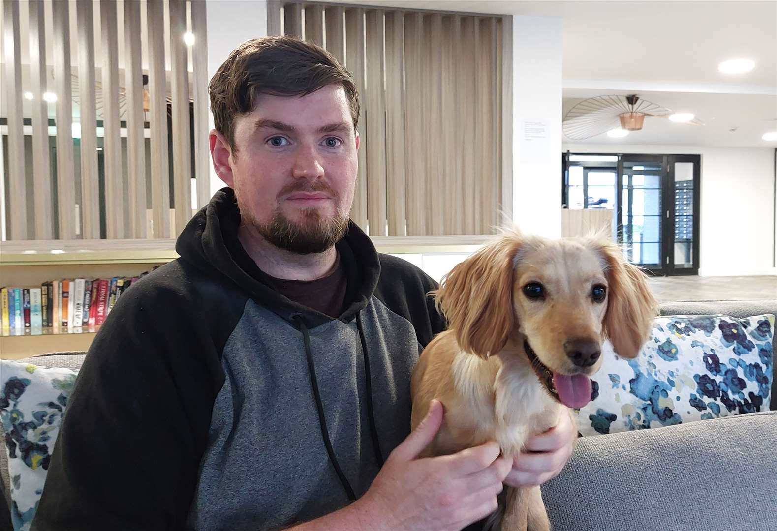 Victoria Point resident Damion Francis with puppy Rogue