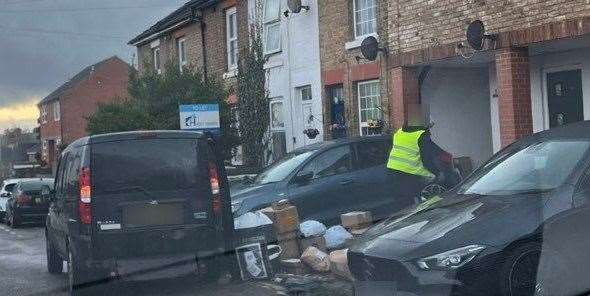 Parcels being sorted in the street in Warwick Place, Maidstone