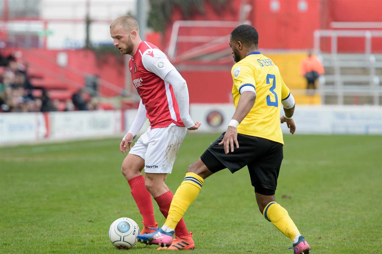 Ebbsfleet goalscorer Luke Coulson holds off Rene Steer Picture: Andy Payton