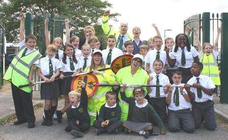 Cheering road safety - Nicole Caulfield, rear left, KCC's Bryan Sweetland and Rosemary Dymond with pupils from Riverside Infant and Junior Schools