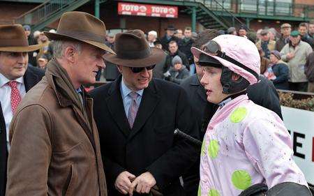 Jockey Paul Townend (corr), in conversation with owner Rich Ricci (centre), and trainer Willie Mullins after winning The Bar One Racing Royal Bond Novice Hurdle on Zaidipour at Fairyhouse Racecourse, co. Meath.