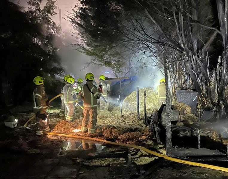 Firefighters worked to extinguish the stables in Worth, Deal after they went up in flames. Picture: Katie Mo