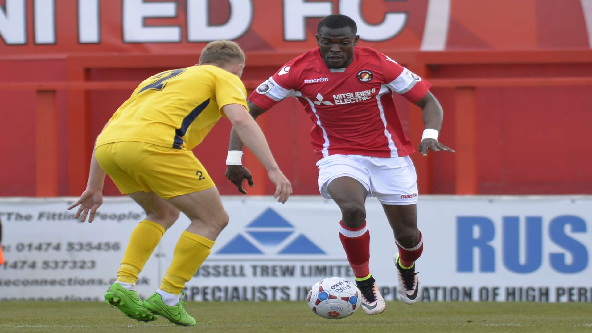 Anthony Cook takes on Eastbourne right-back Jake Sheppard Picture: Ruth Cuerden