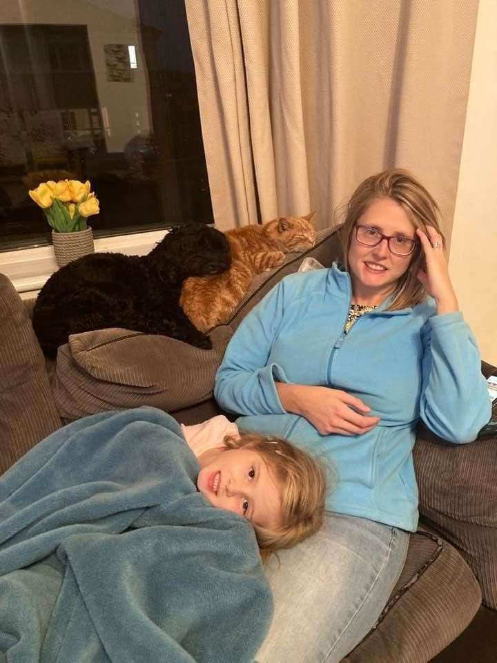 Lee Anne Porteous. with daughter Emma, six, dog Marley and cat Tigger, said she began feeling unwell in May 2020 (Family handout/PA)