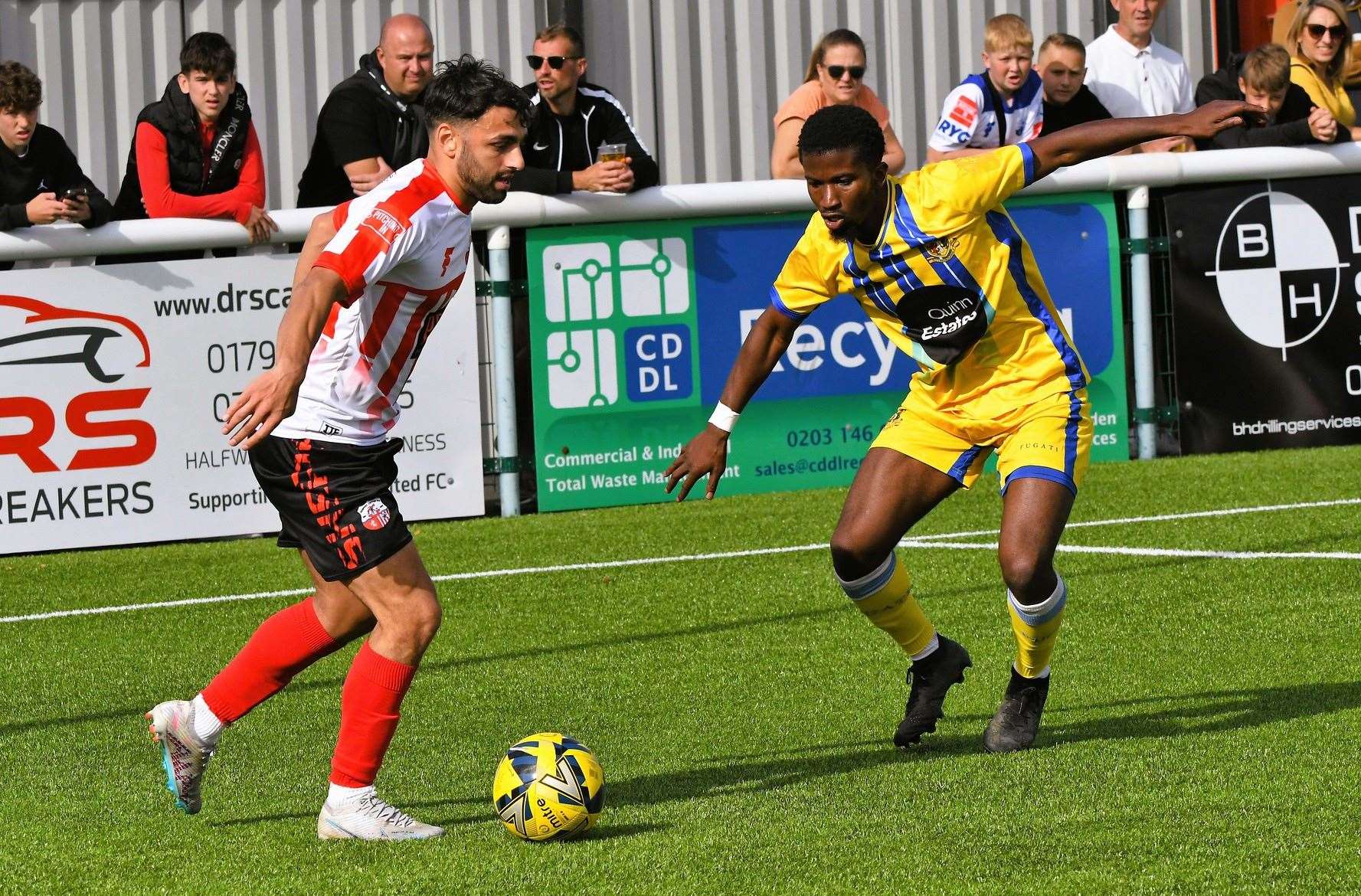 Sittingbourne defender Donvieve Jones closes down Sheppey winger James Bessey-Saldanha Pictures: Marc Richards