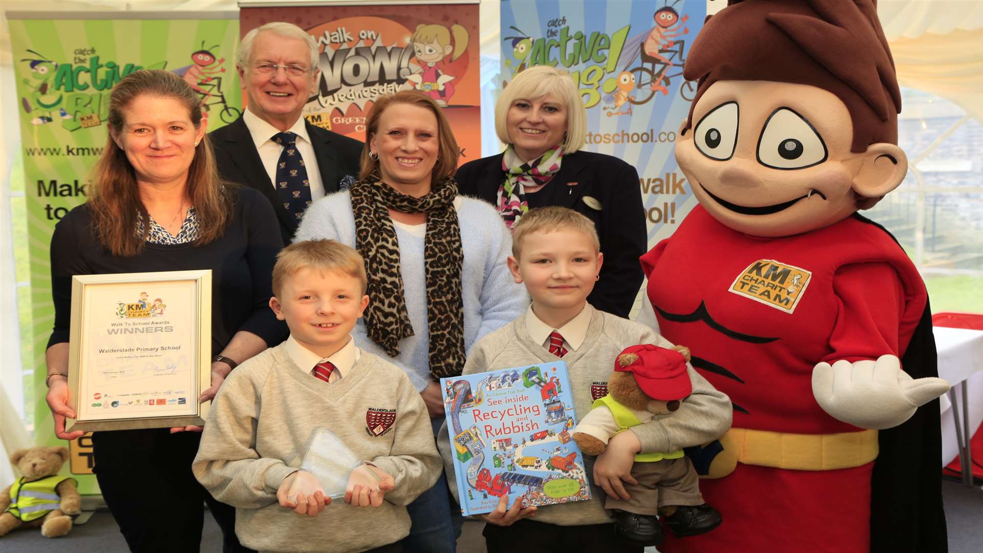 The county's Top Walking Bus winners Walderslade Primary School at the KM Walk to School Awards with mascot Wowzer and supporters from Medway Council and Specsavers at Commissioner's House, Historic Dockyard, Chatham.