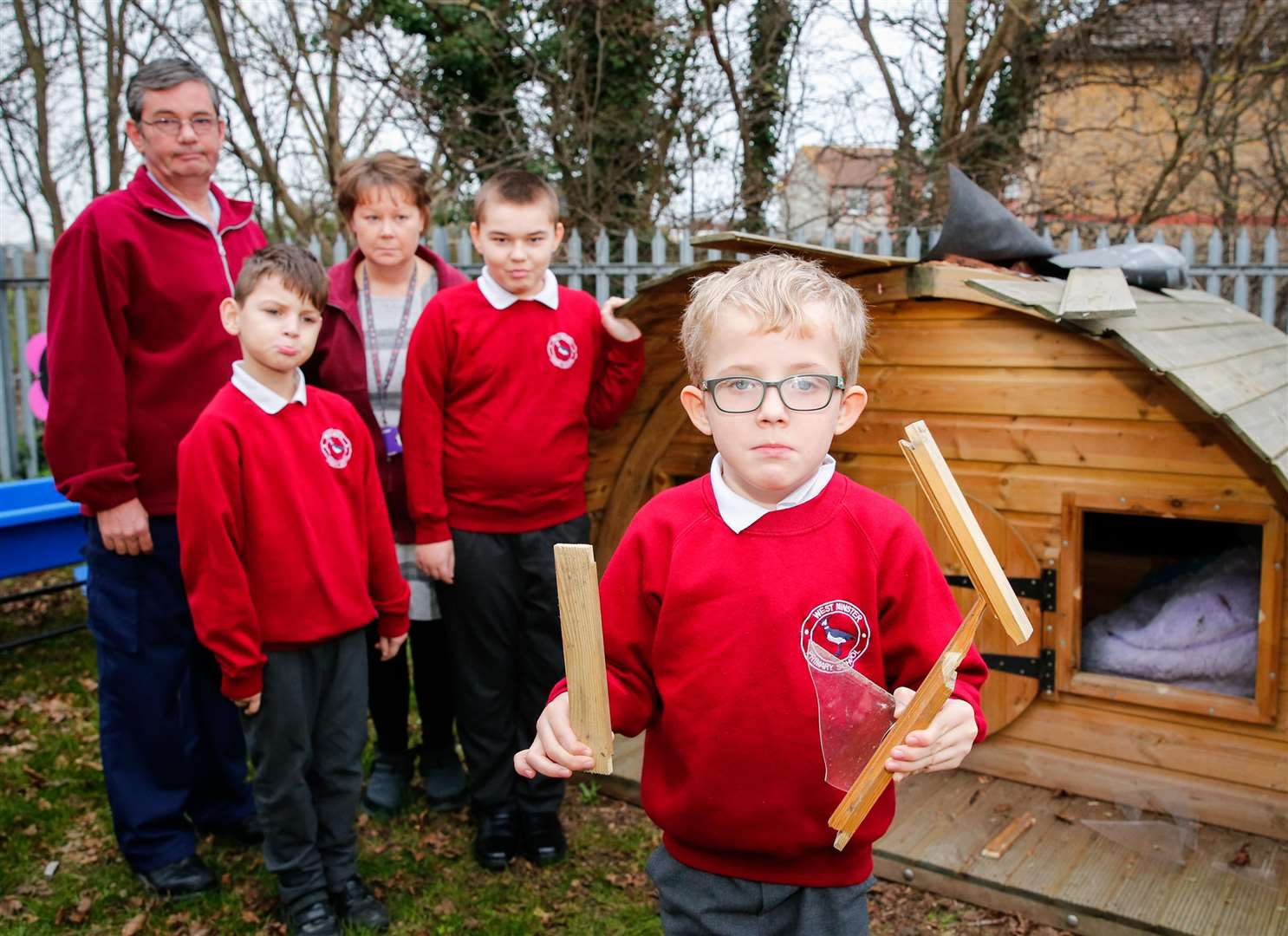 Caretaker Martin Walker and teacher Vicki Elliott with some of the children