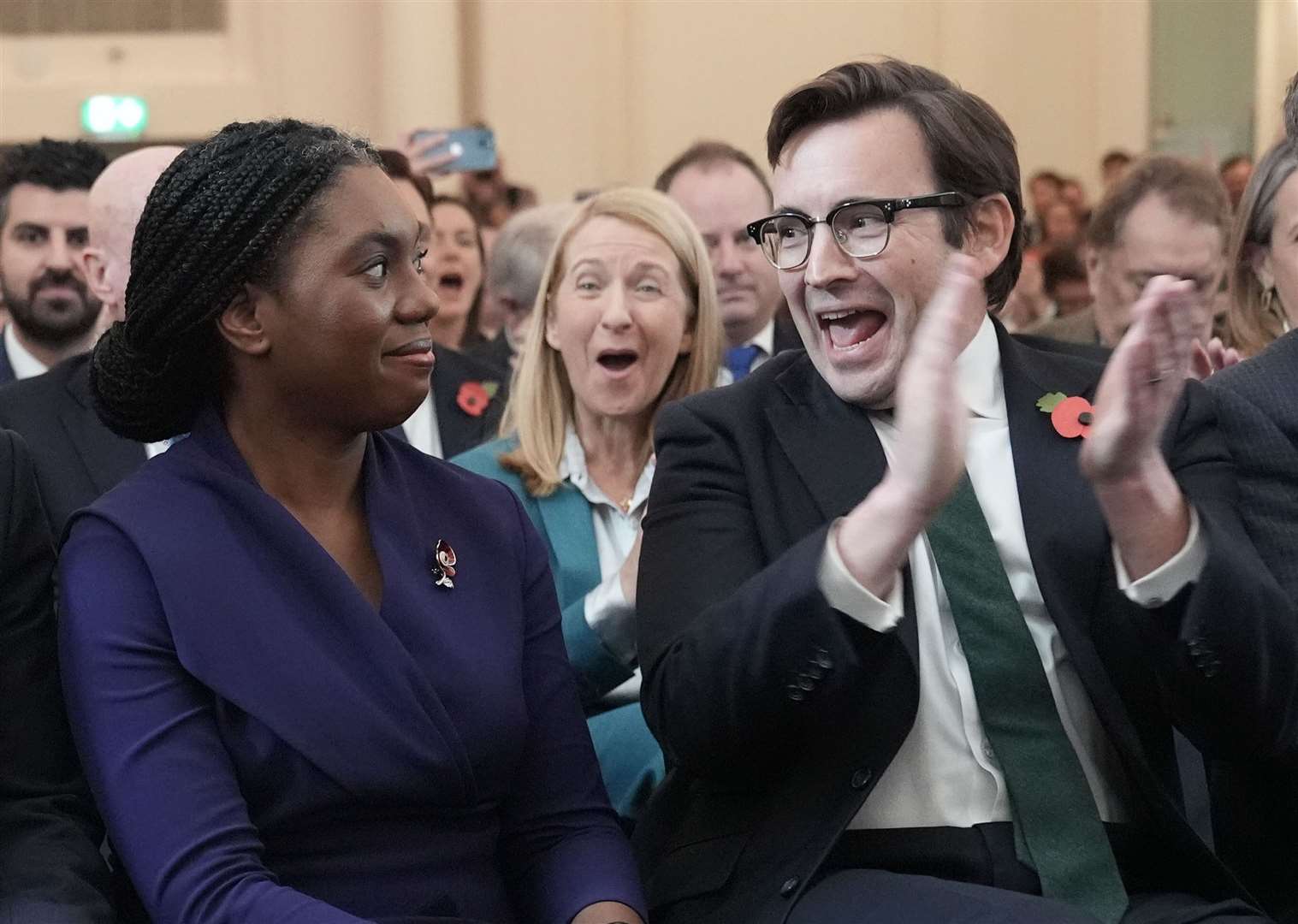 Kemi Badenoch’s husband Hamish applauds in delight as she is announced as the new Conservative Party leader (Stefan Rousseau/PA)