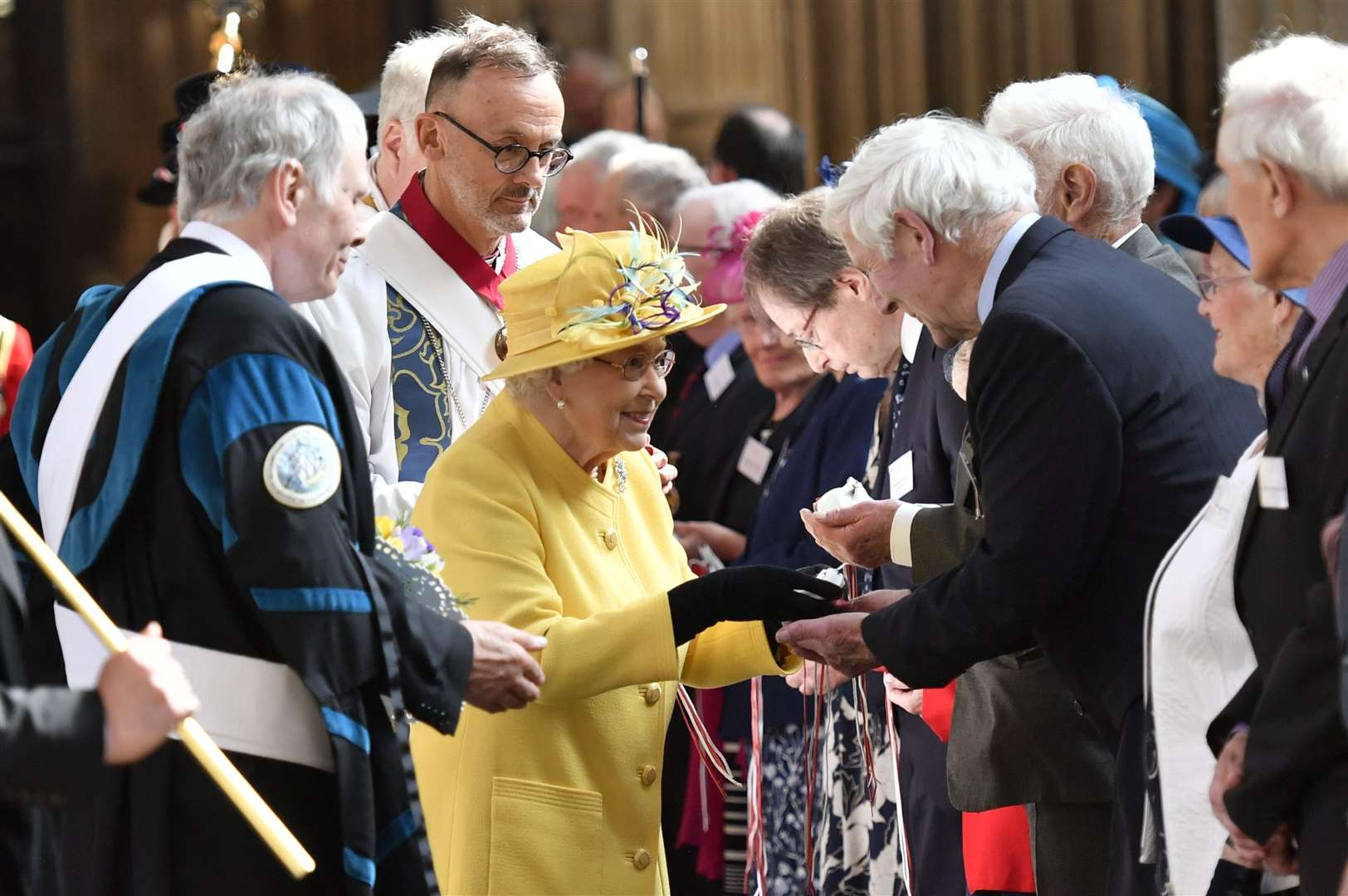 The Queen distributes Maundy money during the 2019 service at St George’s Chapel in Castle Windsor. (Arthur Edwards/The Sun)