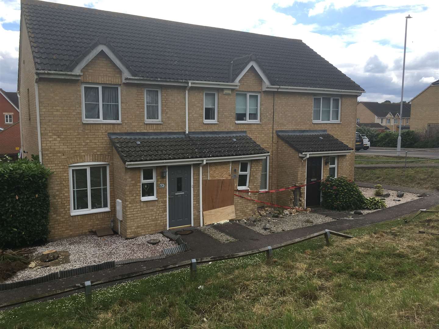 A Vauxhall Astra car crashed into these houses in Quinton Road at the junction of Sonora Way in Sittingbourne (12397878)