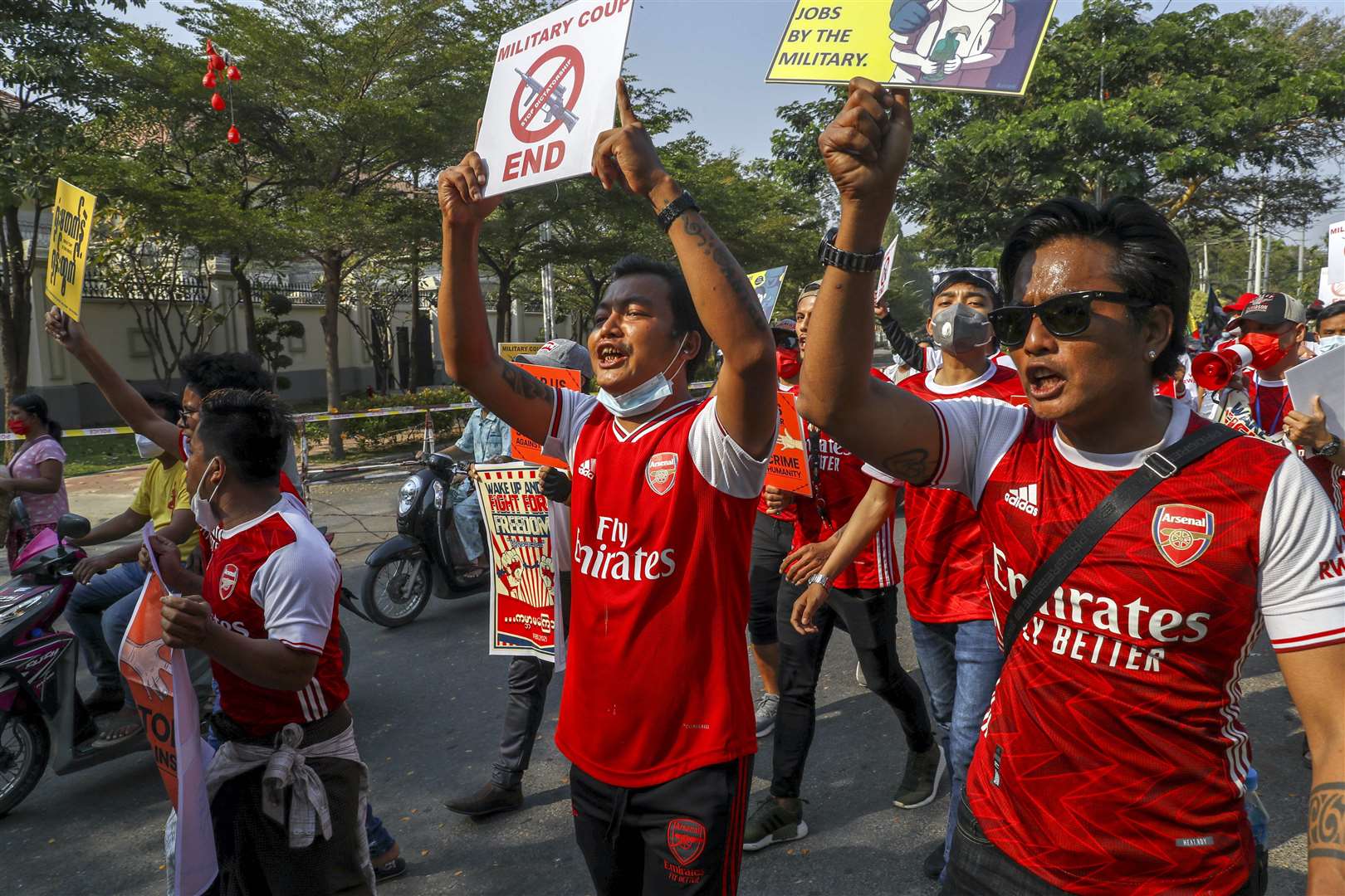 Some people protesting against the military coup in Mandalay, Myanmar, wore Arsenal tops (AP)