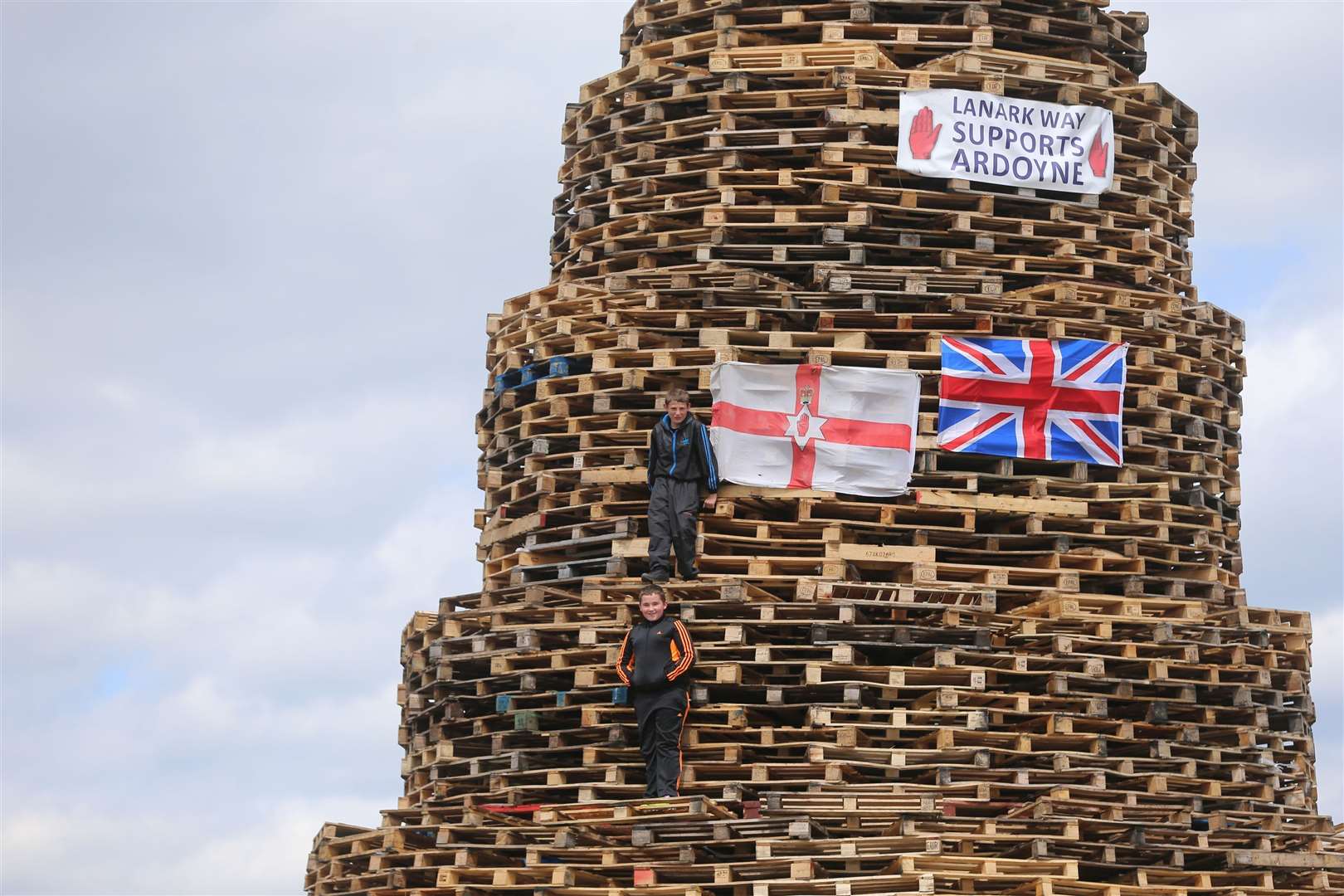 Young bonfire builders in the New Mosley area of Belfast (Niall Carson/PA)