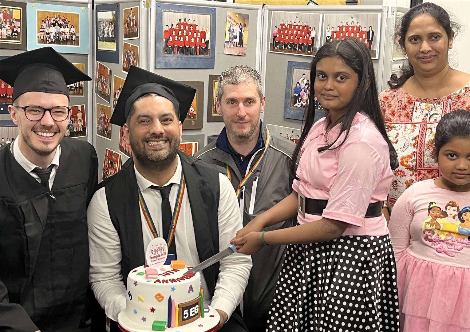 Head teacher Leon Dawson, centre, was joined by deputy head James Davies and parent governor Darren Povey to enjoy cake made by parent Mary Jamila Sriniranjan and daughters Akshana and Akshara