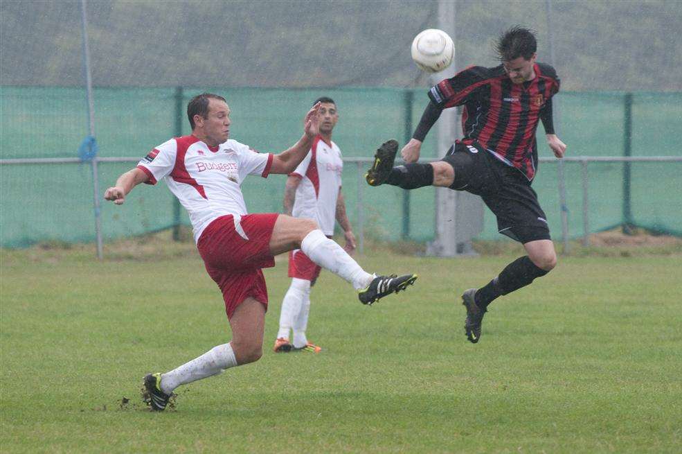 Sittingbourne (red and black) on their way to a 1-0 win over Whitstable at Woodstock Park - their only league victory so far this season