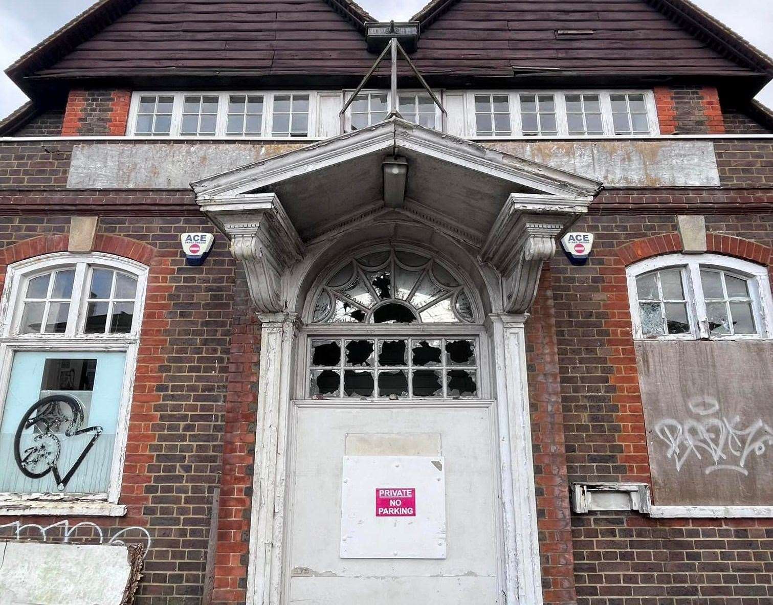 A warning sign on the door of the former Bat and Ball pub does not deter intruders. Picture: Southborough Society