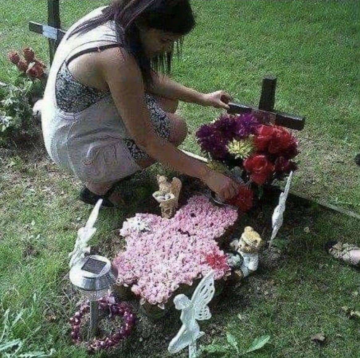 Natasha Alleyne, by the grave of her daughter Indie Rose who was stillborn in 2010. Picture: Jessica Alleyne (52966837)