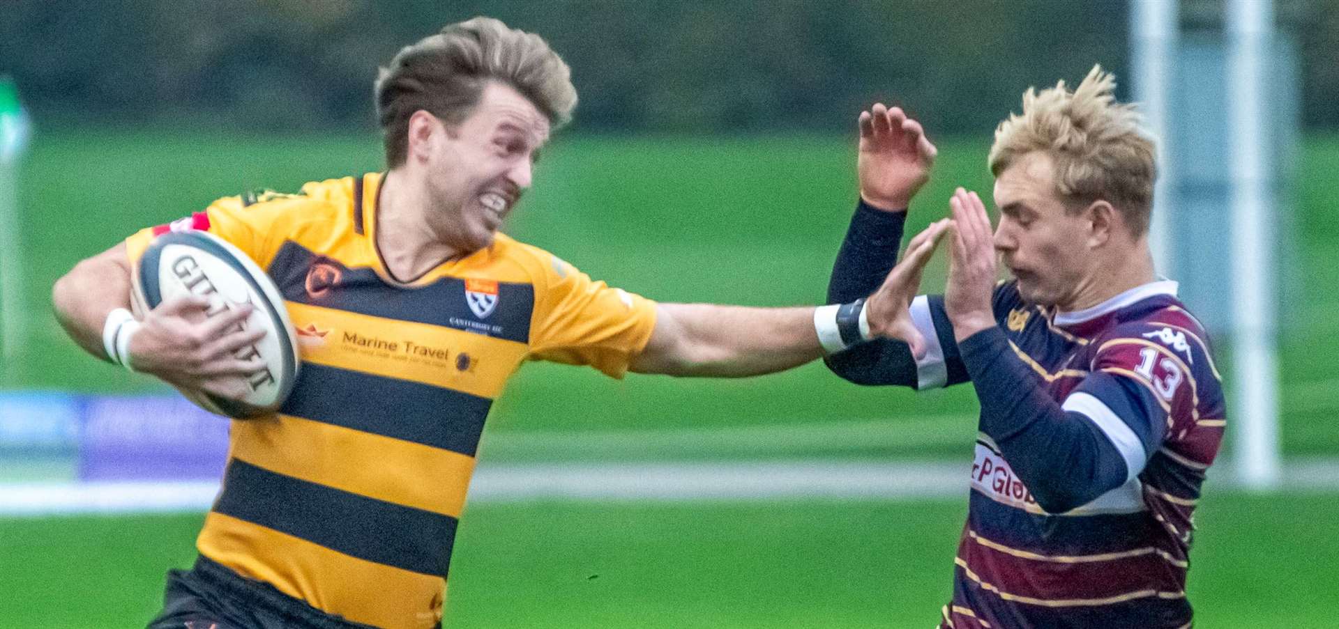 Alfie Orris, left, keeps Old Albanian at arm's length in November’s game, which was won 54-17 by Matt Corker’s Canterbury side. Picture: Phillipa Hilton