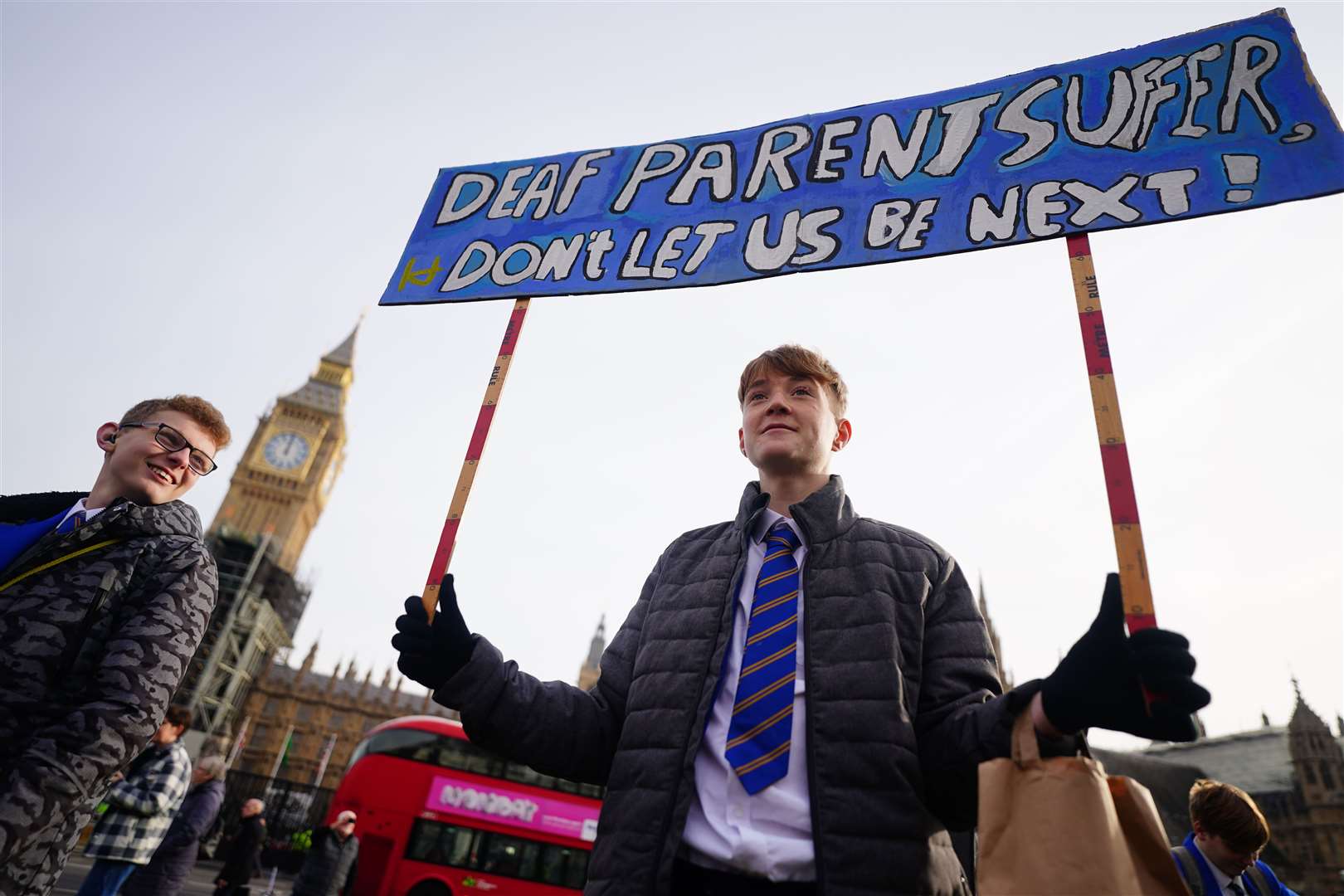 Students from Heathlands School for Deaf Children in St Albans take part in a rally outside the Houses of Parliament (Victoria Jones/PA)