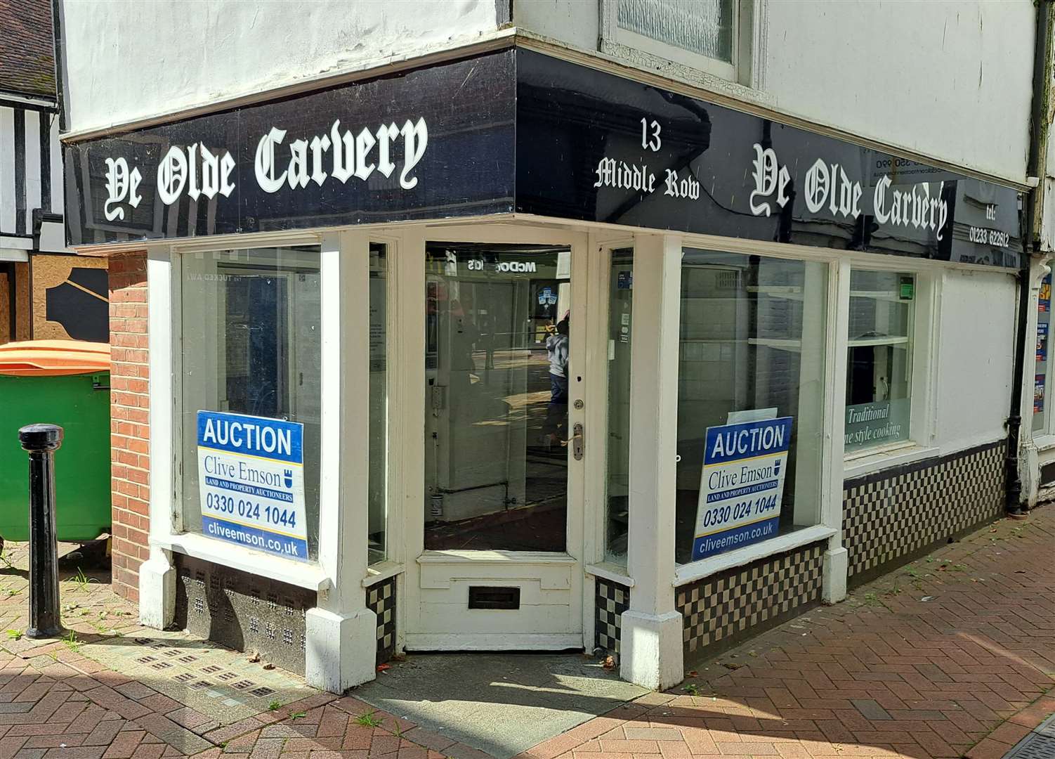 The now-empty bakery with the auction signs up