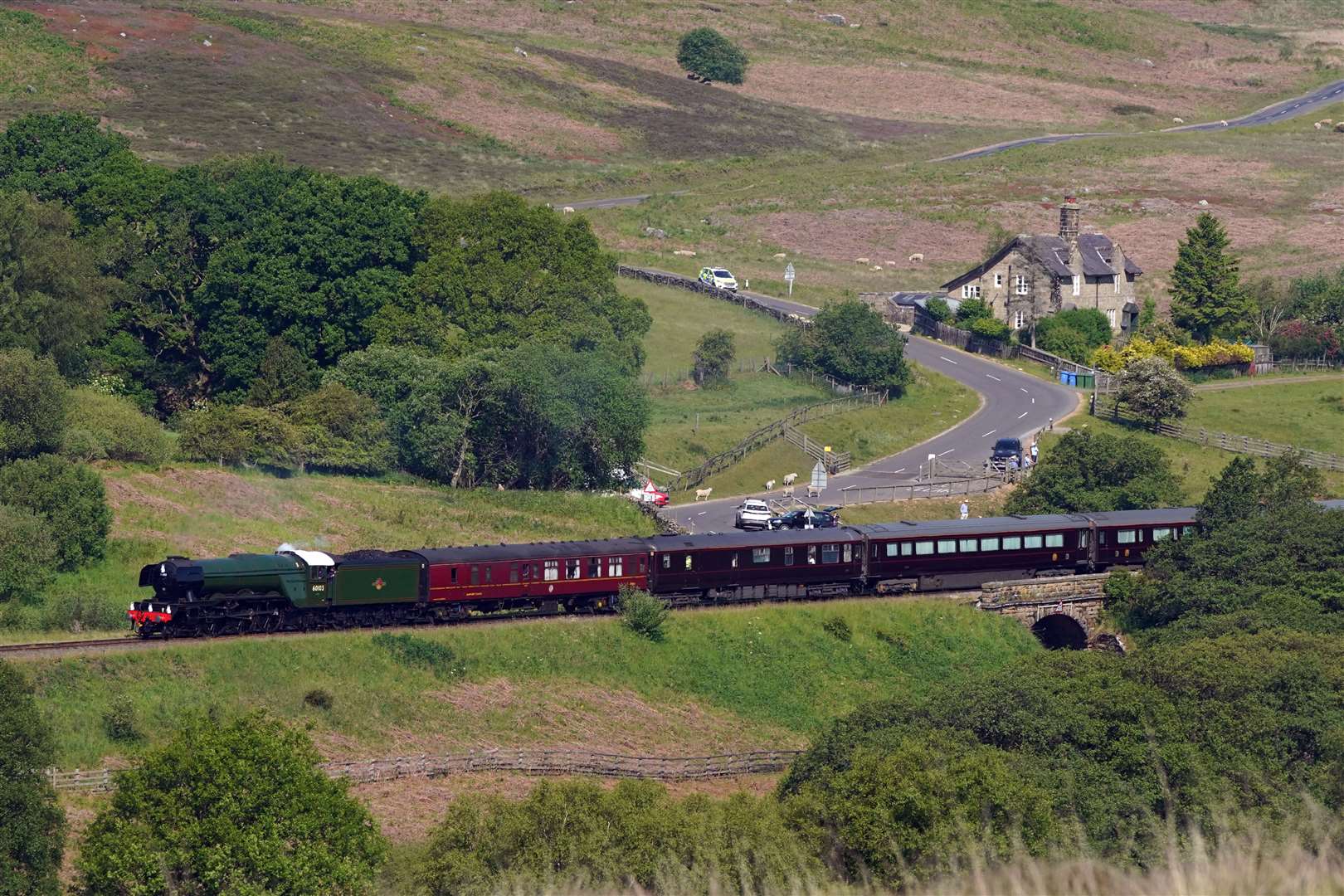 The Royal Train pulled by the Flying Scotsman passes through Goathland in North Yorkshire (Owen Humphreys/PA)