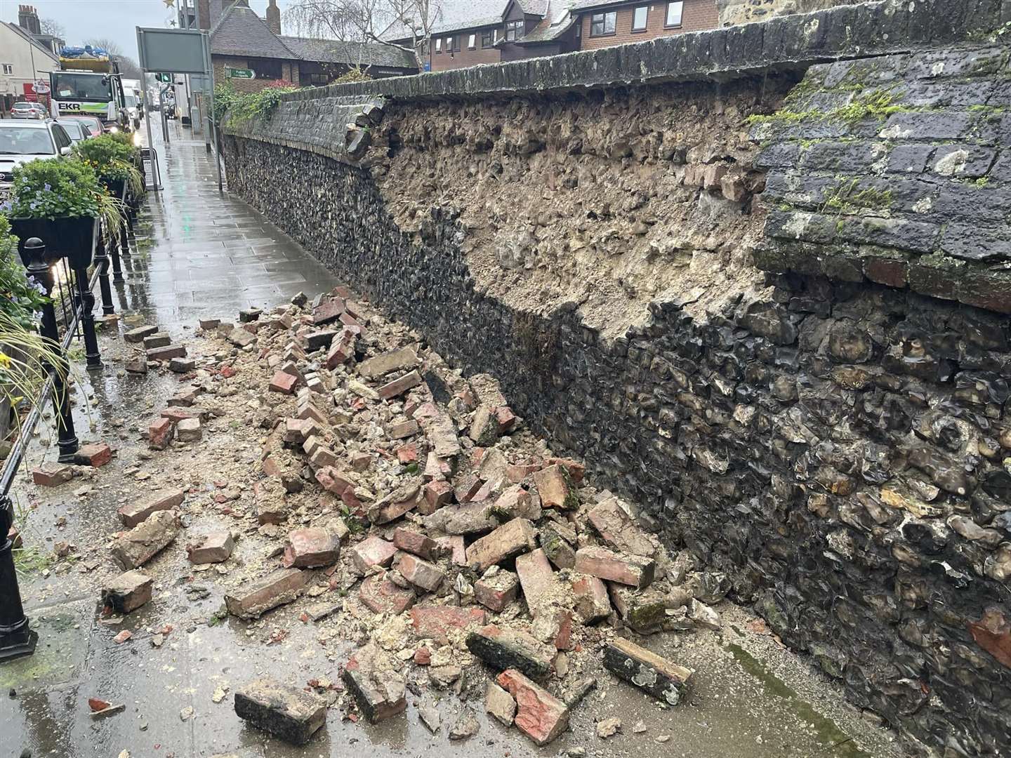 Remnants of the wall after it collapsed onto the pavement at St Margaret's Church, Rainham