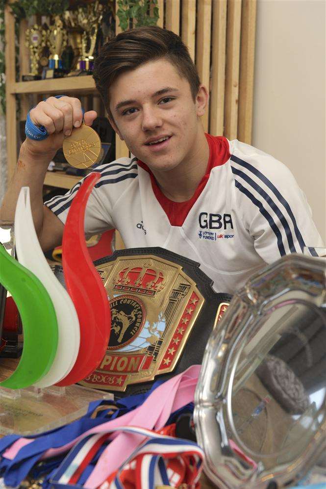 Giarnni with some of his and brother Emilios's trophies.