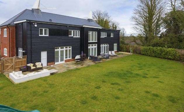 The rear of the property overlooks countryside