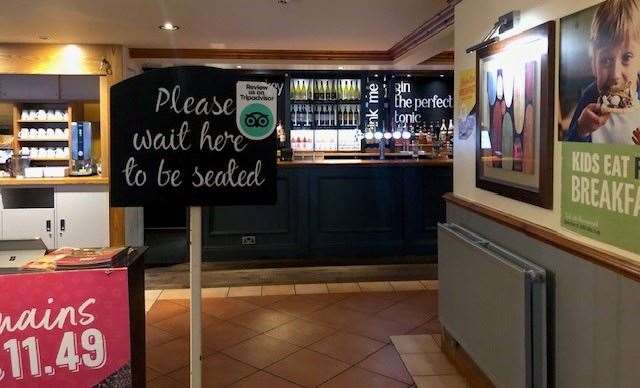 The first thing you’ll see once you’re through the front door is the sign asking you to wait to be seated