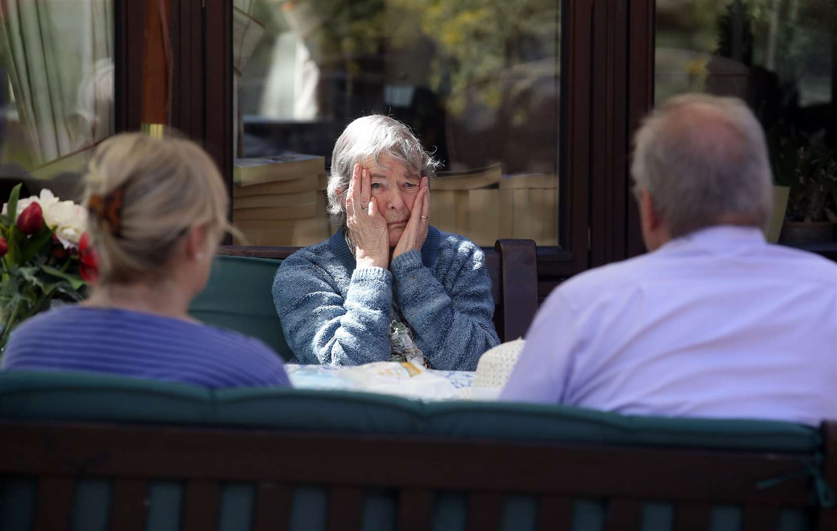 Margaret Yeoman, 90, sees her son John Yeoman, 62, and his wife Denise, 63, for the first time in weeks (Owen Humphreys/PA)