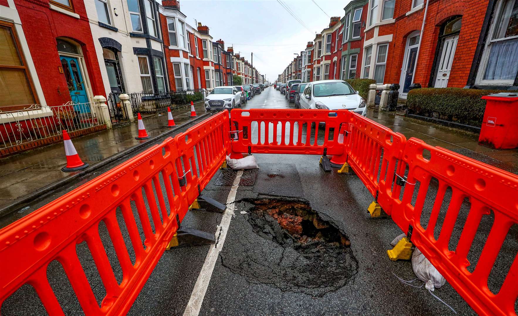 A sink hole that has appeared in Ashbourne Road in Aigburth, Liverpool, as Storm Christoph is set to bring widespread flooding, gales and snow (Peter Byrne/PA)