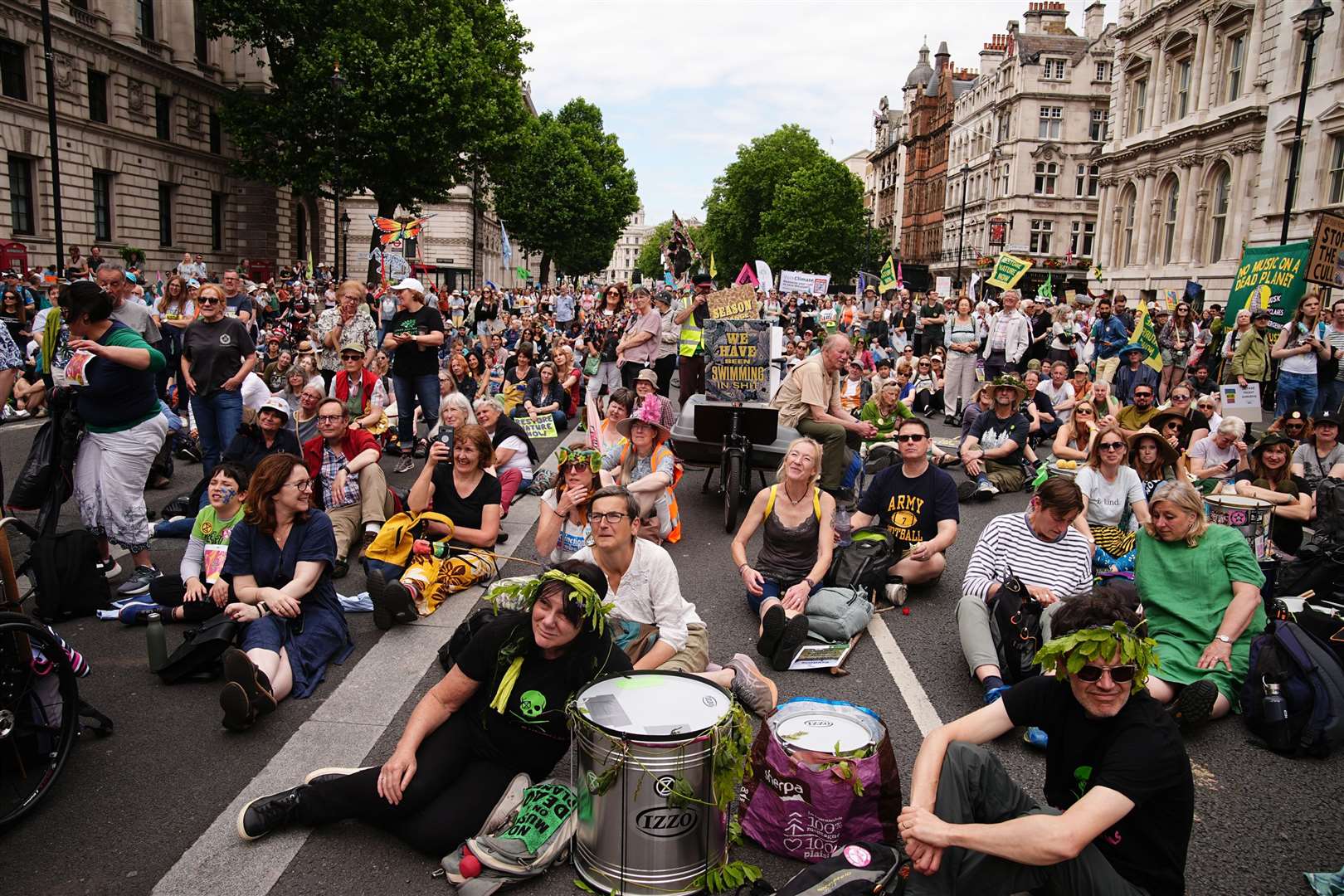Protesters sat on Whitehall during the Restore Nature Now demo (Aaron Chown/PA)