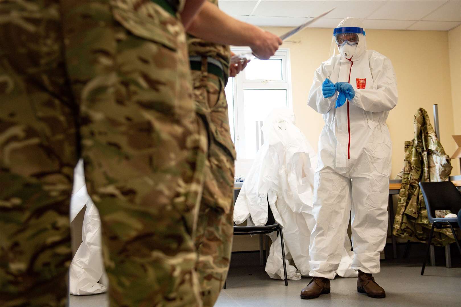 Members of the British Army learnt how to apply PPE (Jacob King/PA)